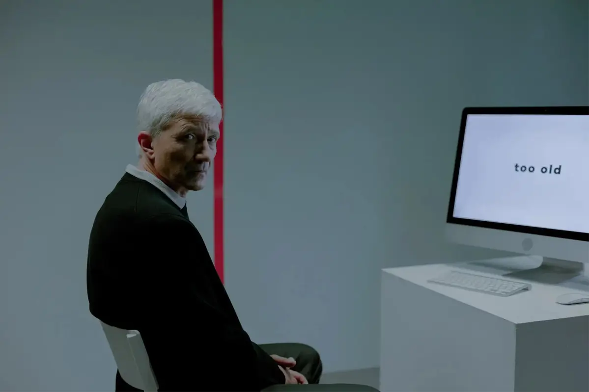 A man sitting in front of a computer.